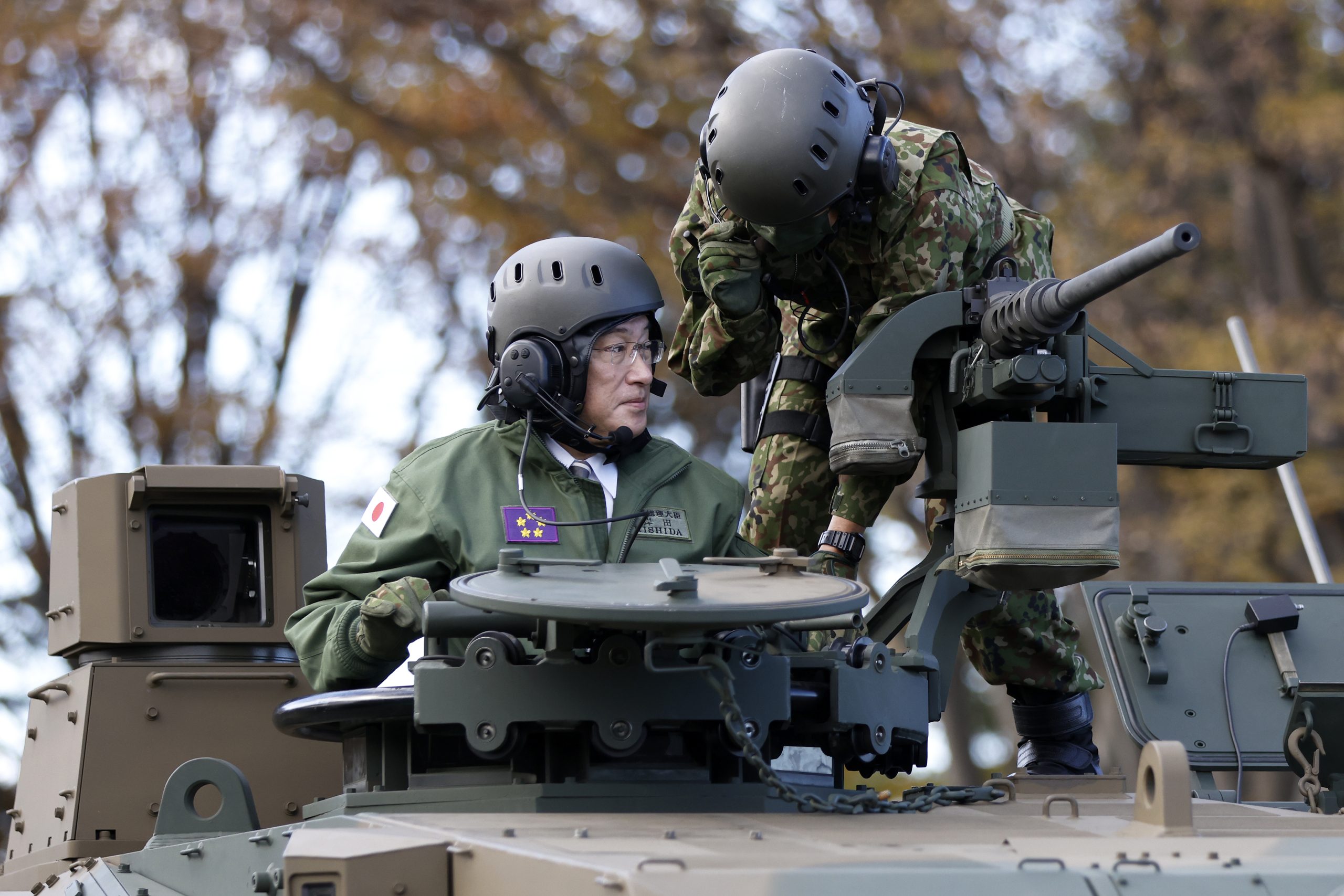 Japanese Prime Minister Fumio Kishida behind a bodyguard in Bucha March  2023 [2241x2867] : r/MilitaryPorn