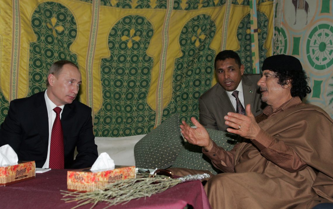 Vladimir Putin and Muammar Qaddafi