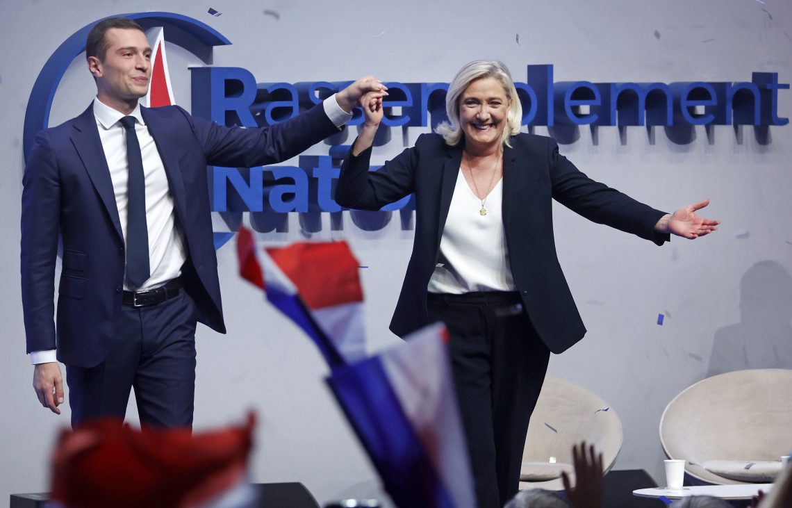 Jordan Bardella (left), president of Rassemblement National (National Rally), with long-time party leader Marine Le Pen at a party rally in Paris, France.