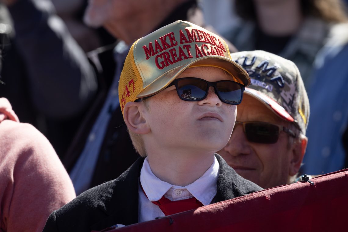 A boy in MAGA cap