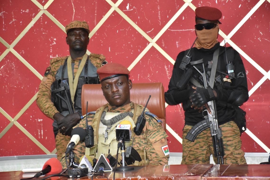 Ibrahim Traore, flanked by armed men, at a news conference in October 2022 in Ouagadougou, Burkina Faso.